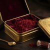 Crimson threads of Kashmiri Mongra Saffron arranged in a luxury gold tin box with royal velvet lining