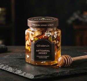 Hexagonal artisan honey jar filled with whole cashews, almonds, and pistachios submerged in golden translucent mountain honey with edible silver leaf accents on a black slate slab with a wooden honey dipper, luxury gourmet confection.