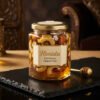 Honista Real Honey Dipped Nuts inside luxury hexagonal glass jar with edible silver leaf and whole nuts