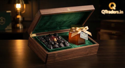 Luxurious dark walnut box lined with royal green velvet containing Madinah Ajwa dates and a hexagonal jar of raw golden Sidr honey tied with golden ribbon, warm golden lighting studio food photography